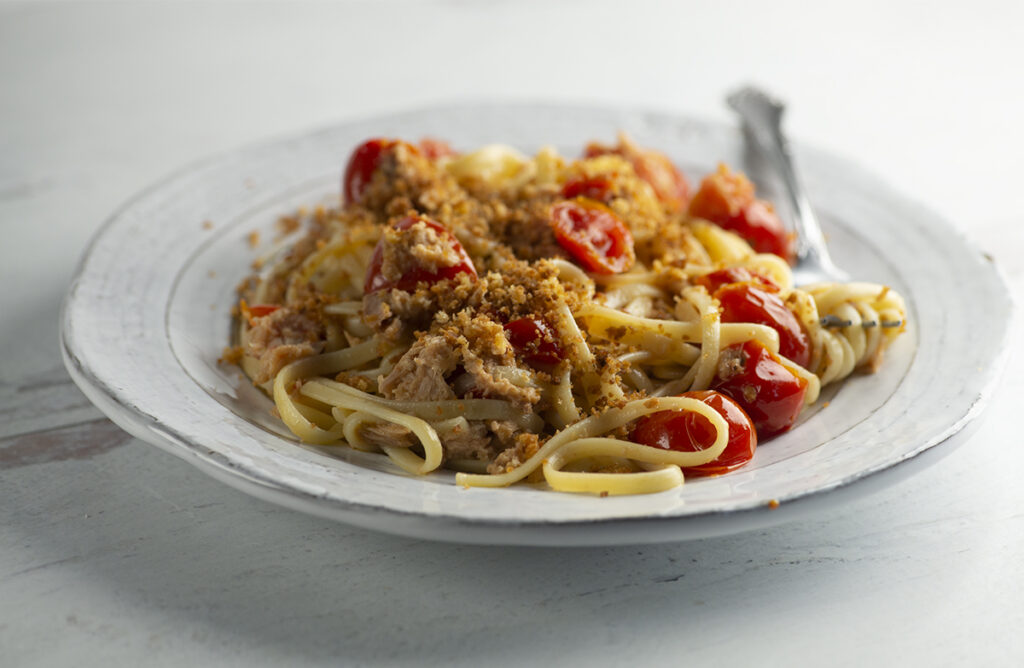 Tuna pasta on a plate with a fork.