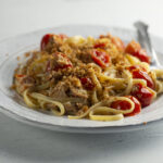 Tuna pasta on a plate with a fork.