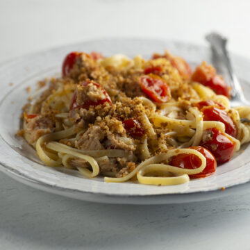Tuna pasta on a plate with a fork.
